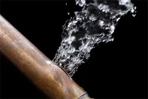 How can heavy rain affect plumbing?